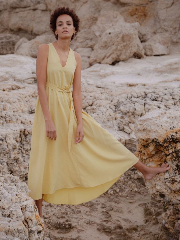 A woman wearing yellow dress by Cecilia Sörensen