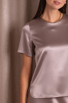 Satin texture detail on women’s nougat shirt