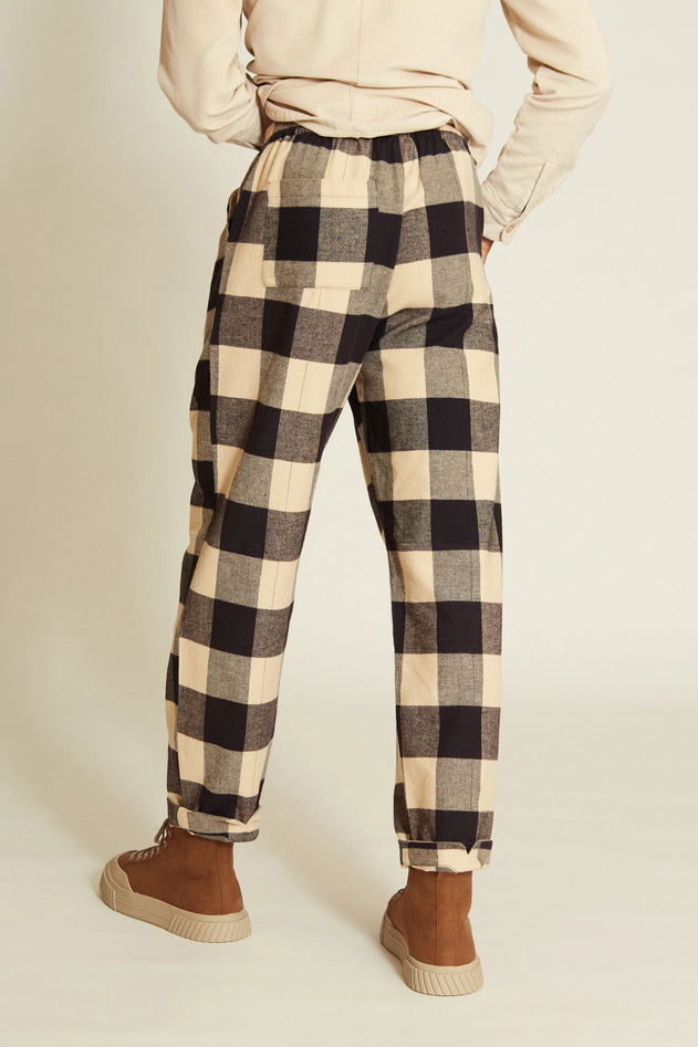 Close-up detail on women’s black pants