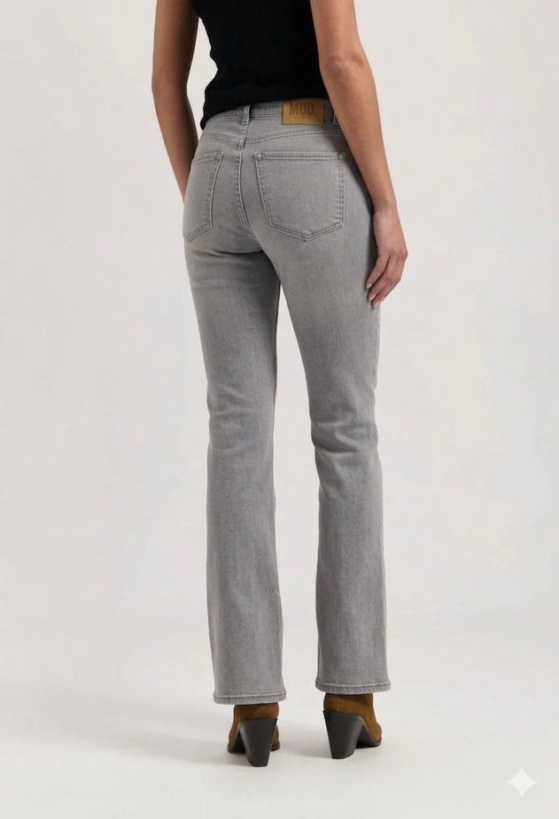 Person wearing gray jeans on a white background