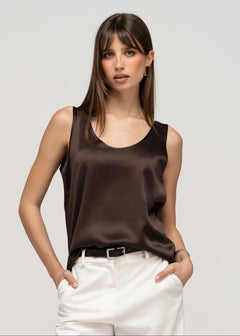 woman wearing brown silk top