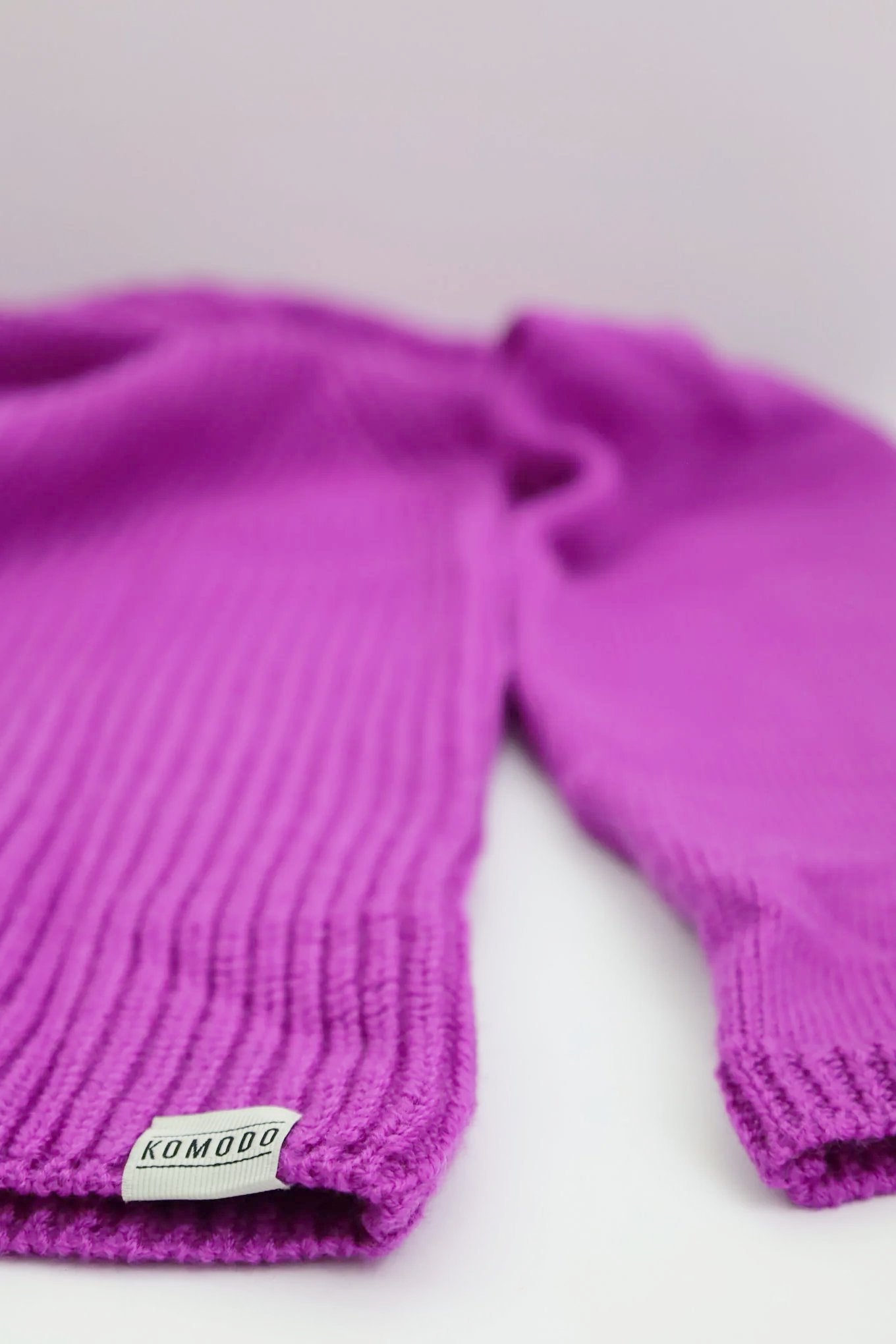 Komodo fuchsia pink merino wool jumper, back view