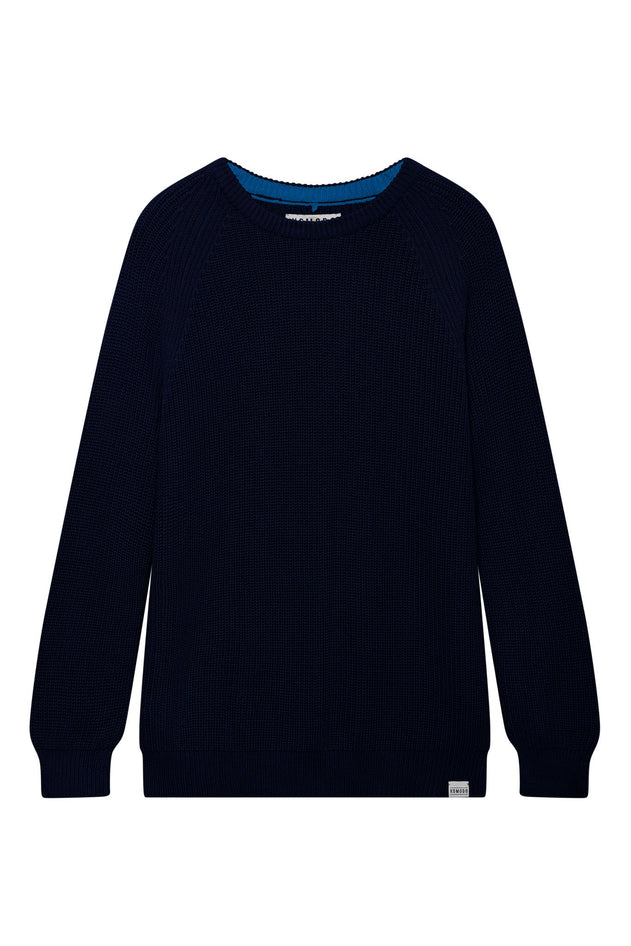 Woman wearing Komodo navy organic cotton rib knit jumper