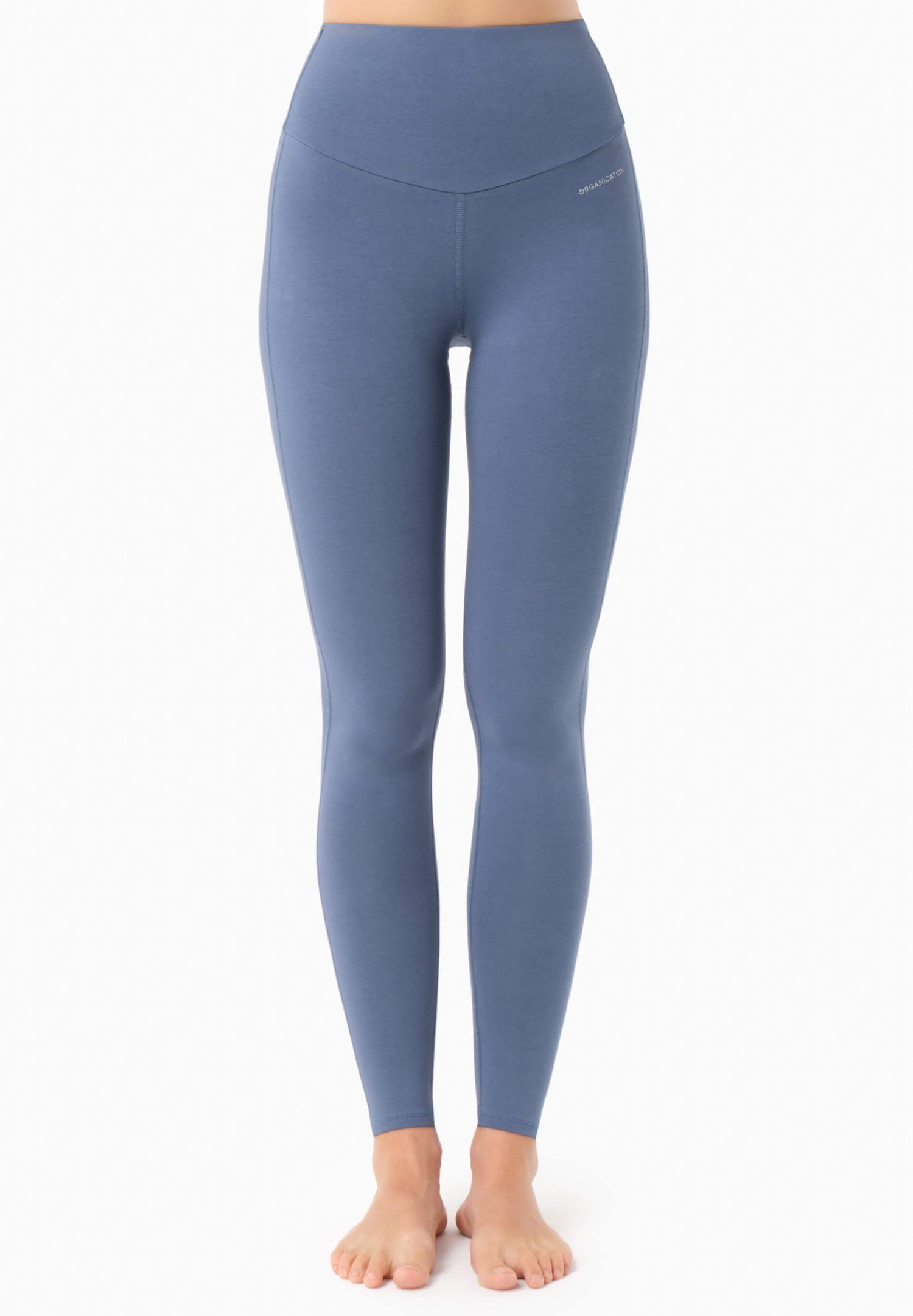 Blue leggings worn by a person on a white background