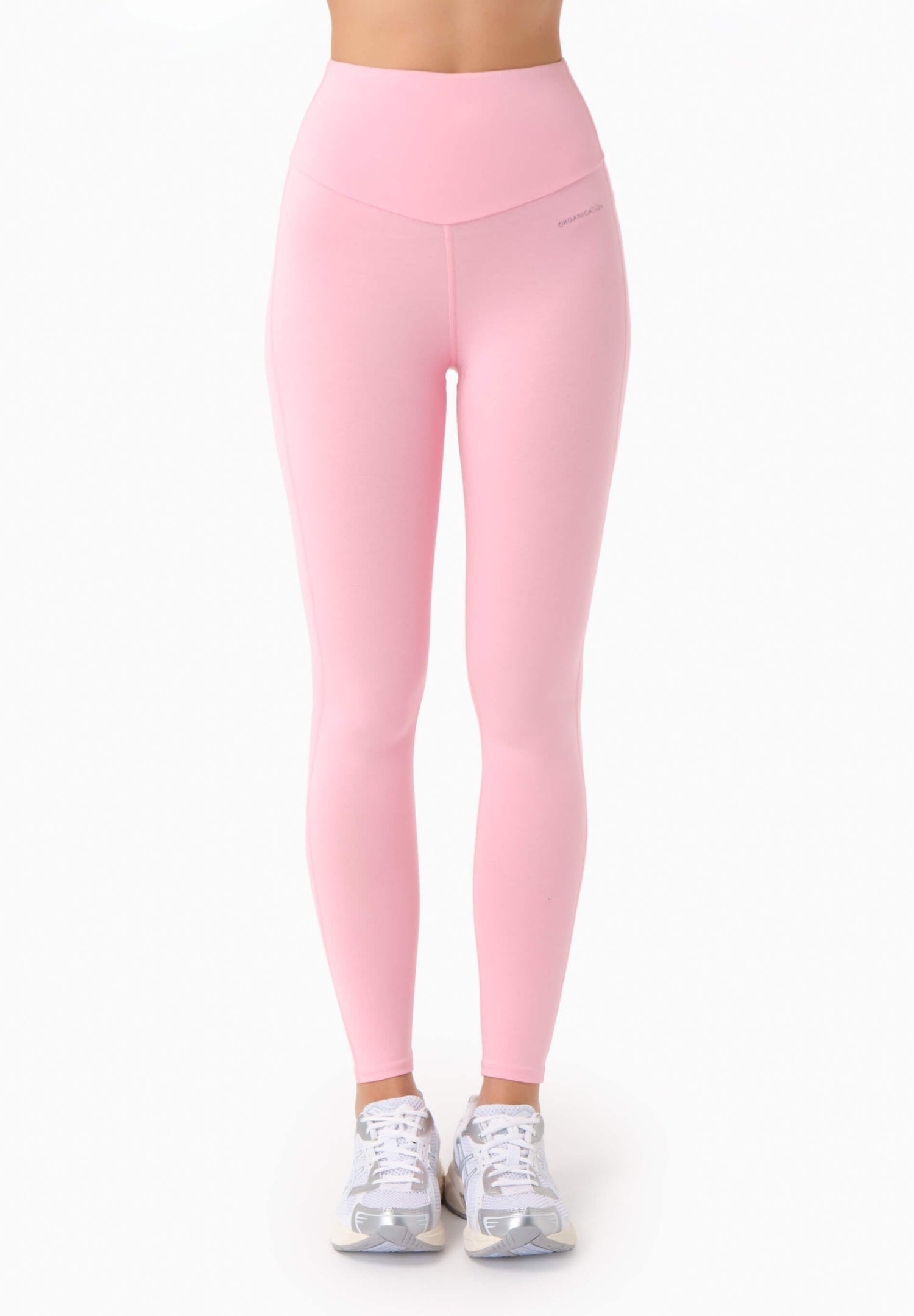 Pink leggings worn by a person on a white background