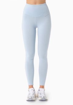 Light blue leggings worn by a person on a white background