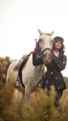 RainSisters-jacket-Cosmic-Meadow-waterproof-black-with-white-polka-dots-with-colorful-flowers-side.jpg?v=1780399263