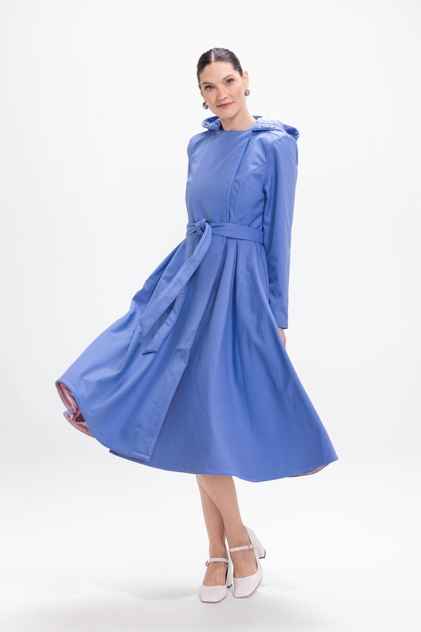 rainsisters-coat-blue-breeze-waterproof-blue-in-motion.jpg?v=1779048953