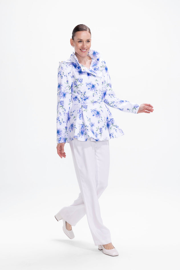 rainsisters-coat-blue-whisper-waterproof-white-floral-print-in-motion.jpg?v=1779049991