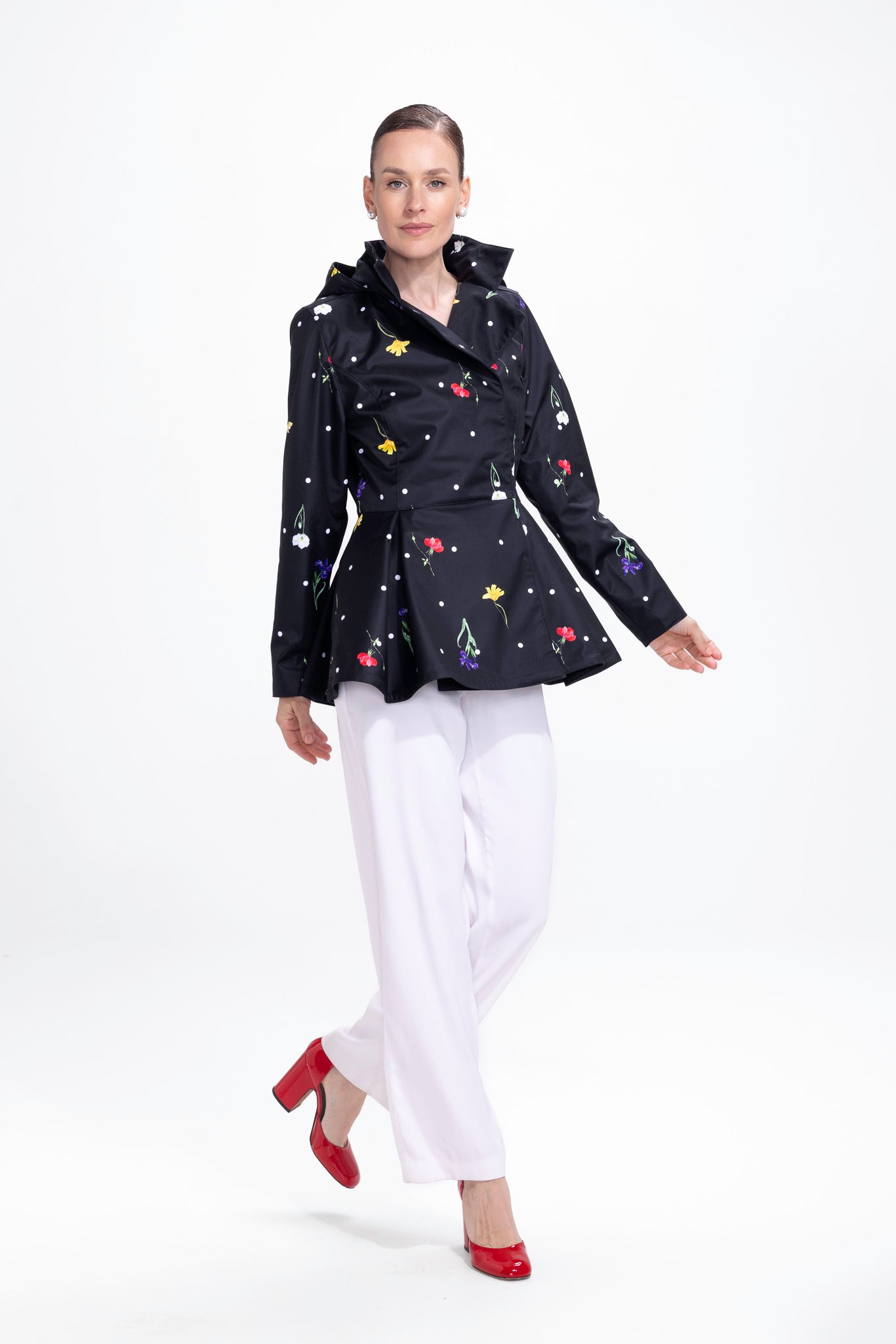 rainsisters-coat-cosmic-meadow-waterproof-black-floral-print-in-motion.jpg?v=1779051266