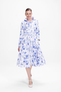 rainsisters-coat-floral-white-waterproof-white-floral-in-motion.jpg?v=1779052631