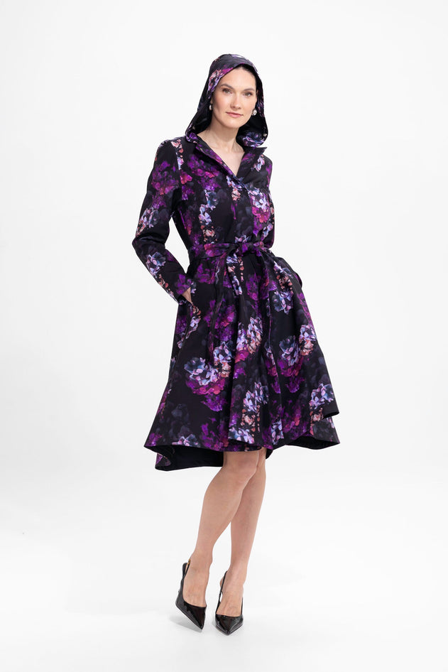 rainsisters-coat-hortense-waterproof-black-floral-in-motion.jpg?v=1779053578