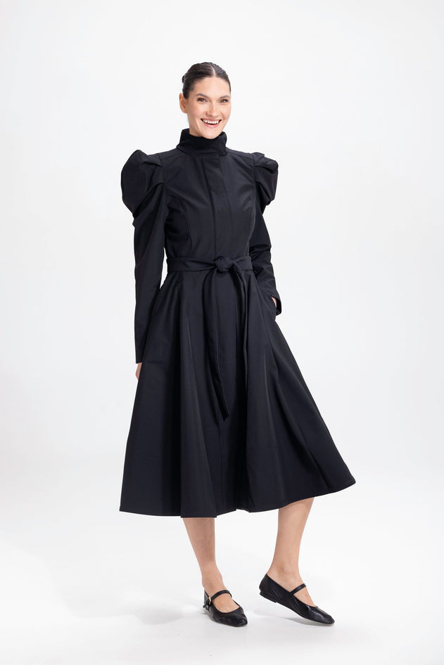rainsisters-coat-majestic-night-waterproof-black-in-motion.jpg?v=1779054199