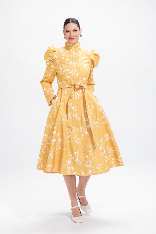 rainsisters-coat-majestic-yellow-waterproof-yellow-floral-in-motion.jpg?v=1779054613