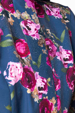 rainsisters-coat-misty-rose-waterproof-blue-floral-close-up.jpg?v=1779055156