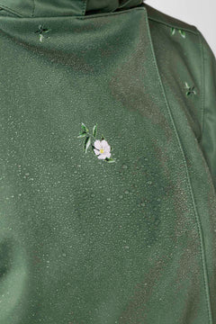 rainsisters-coat-primrose-green-waterproof-green-floral-close-up.jpg?v=1779056013