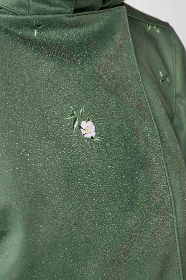 rainsisters-coat-primrose-green-waterproof-green-floral-close-up.jpg?v=1779056013