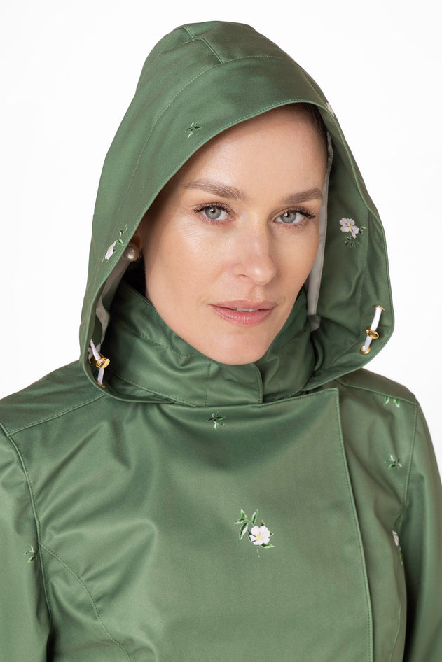rainsisters-coat-primrose-green-waterproof-green-floral-hood.jpg?v=1779056013