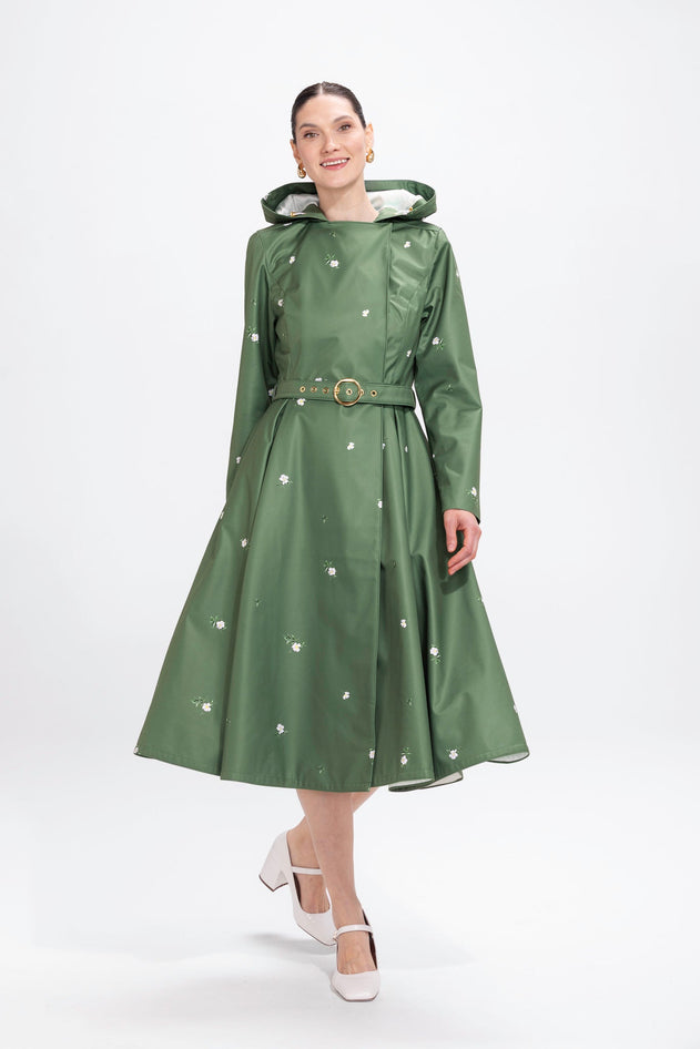 rainsisters-coat-primrose-in-bloom-waterproof-green-floral-in-motion.jpg?v=1779055865