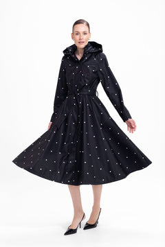 rainsisters-coat-timeless-polka-dots-waterproof-black-dots-in-motion.jpg?v=1779057818