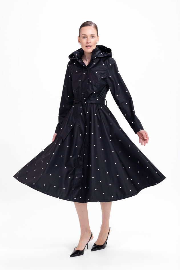 rainsisters-coat-timeless-polka-dots-waterproof-black-dots-in-motion.jpg?v=1779057818