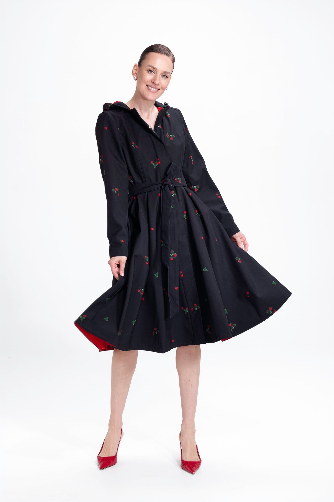 rainsisters-coat-wild-strawberry-waterproof-black-berry-in-motion.jpg?v=1779058543