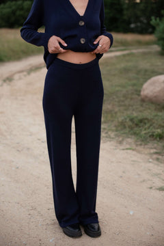 Dark Blue wide-leg merino pants in casual lounge setting