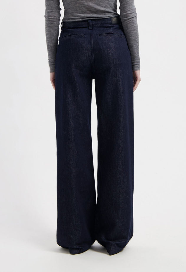 women-sustainable-jeans-june-mid-loose-rinse-half-body-back.jpg?v=1764946209