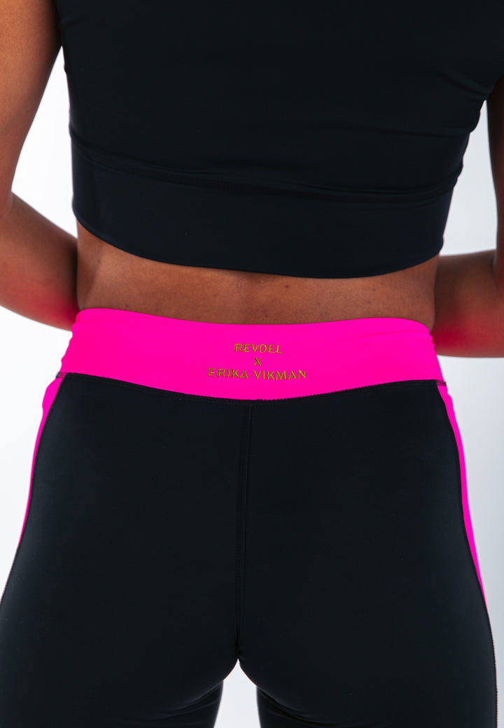  - Revoel X Erika Vikman Stellar Biker Shorts in Black & Shock Pink